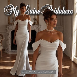 Op de afbeelding: Een vloerlange witte off-shoulder jurk met een gedrapeerd lijfje, een hartvormige halslijn met delicate kanten afwerking en een zijsplit. De tekst My Laine Bridaluxe en Designed for Your Happily Ever After is zichtbaar op de afbeelding.