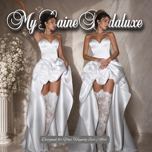 Peut inclure: Deux modèles portent des robes de mariée blanches sans bretelles avec des jupes asymétriques et des bas-cuisses en dentelle. Les robes ont un décolleté en cœur et une traîne fluide. Le texte "My Saine Godaluxe" et "Designed for Your Happily Ever After" sont présents.