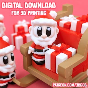 May include: A 3D-printed Santa Claus figure in a sleigh, holding a gift box. The figure is wearing a red suit and hat with white trim. The sleigh is brown with red accents, and the background features additional gift boxes. Text reads "DIGITAL DOWNLOAD FOR 3D PRINTING".