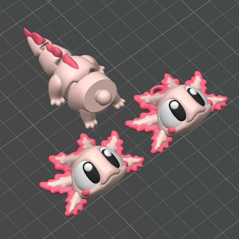 May include: A pink and white axolotl figurine with large eyes and a wide smile. The figurine is segmented into three parts, including the head, body, and tail. The figurine is made of plastic and is approximately 3 inches tall.