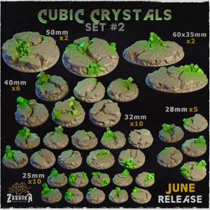 May include: A collection of round, textured gaming bases labeled CUBIC CRYSTALS SET #2. The set includes various sizes: 50mm (x2), 60x35mm (x2), 40mm (x6), 32mm (x10), and 25mm (x10). Each base features cracked stone surfaces with bright green crystals.