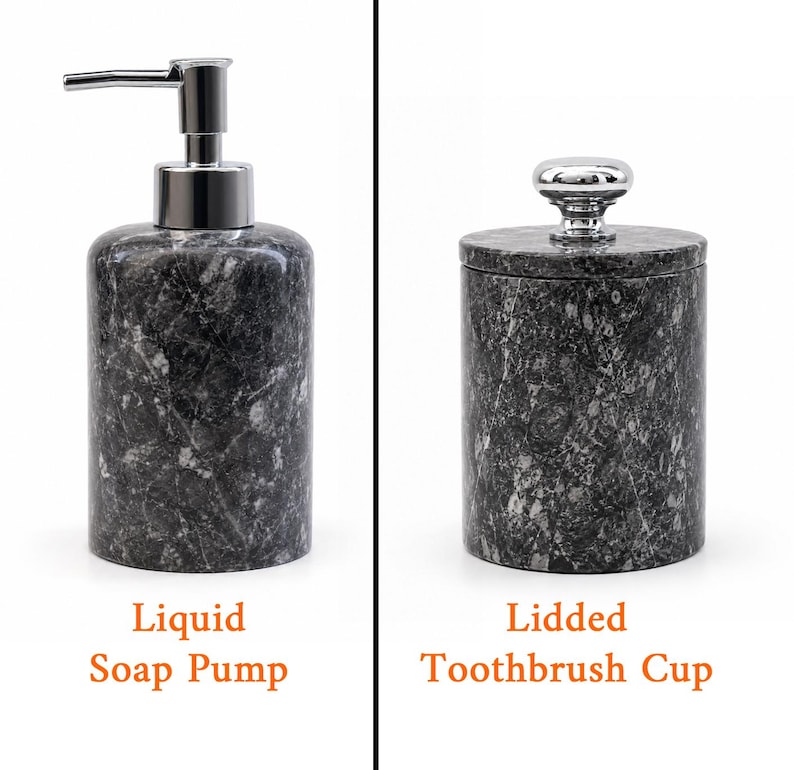May include: A dark gray marble liquid soap pump with a silver-toned metal dispenser and a matching lidded toothbrush cup featuring a silver-toned knob handle. Both cylindrical bathroom accessories display a natural stone pattern with white veining.