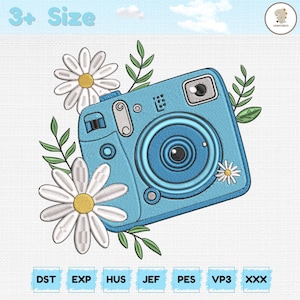 May include: A light blue embroidered camera design with white daisies and green leaves. The image includes the text "3+ Size" at the top and embroidery file format abbreviations at the bottom.