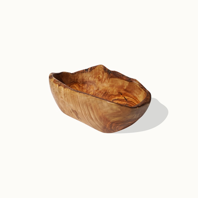 Side View of Handcrafted Olive Wood Rustic Fruit Cup displaying its curved edges and unique natural textures.
