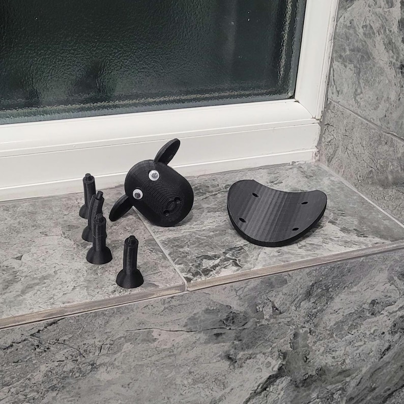 sheep toilet roll holders designed to be fitted into inner toilet roll or loo rolls as a fun sheep holder. googley eyes and black colour. 4 legs with a base and head. no mouth variation.