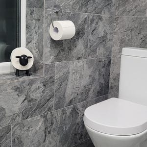 sheep toilet roll holders designed to be fitted into inner toilet roll or loo rolls as a fun sheep holder. googley eyes and black colour. 4 legs with a base and head. no mouth variation.