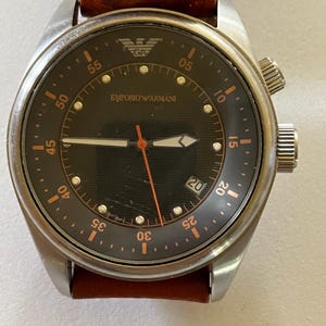 EMPORIO  ARMANI date Qts AR-0517  50 meters 5 atm stainless steel all original used lightly