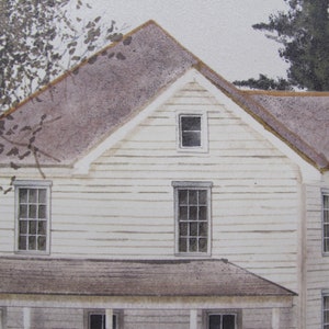 May include: A white clapboard house with a brown roof and multiple windows. The house has a porch with a railing and a small tree in the background.