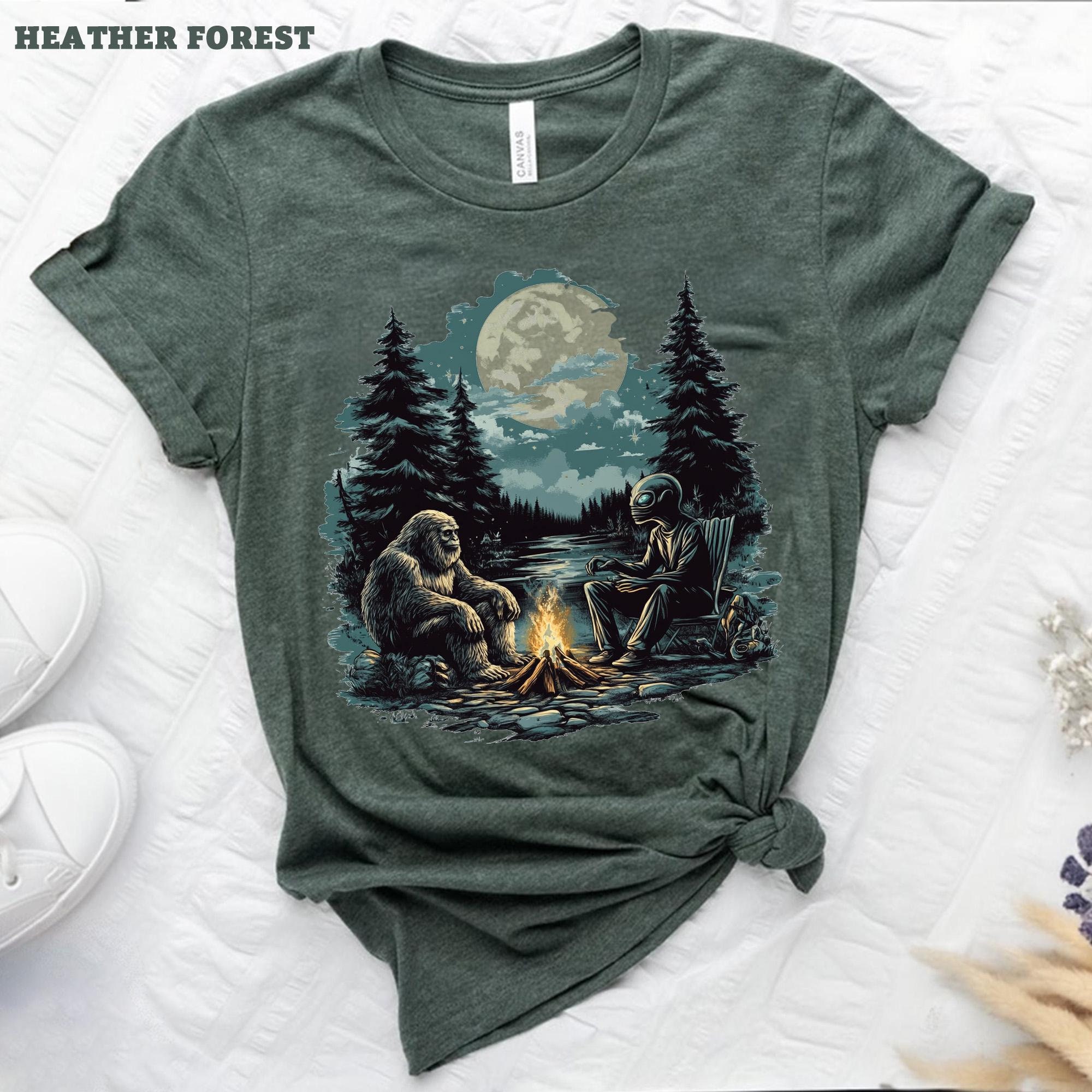 Bigfoot And Alien Campfire T-Shirt, Cryptid Alien Outdoor Tee, Mystical Forest Design, Fun Camping Graphic Tee, Unique Surreal Gift Shirt