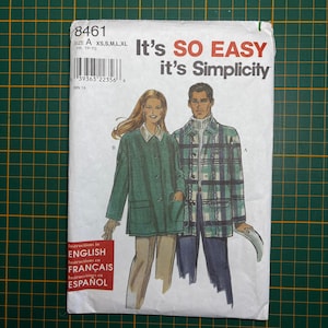 May include: A Simplicity sewing pattern envelope 8461 featuring illustrations of two individuals wearing jackets. One person wears a solid green jacket with a collar and pockets, while the other wears a plaid jacket with a turtleneck. Text includes 8461.