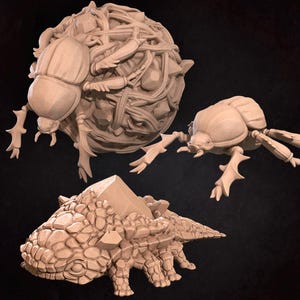 May include: Three beige, stylized insect sculptures. One is a large, spherical form with a beetle attached. Another is a beetle with detailed legs and body. The third is a segmented, armored creature with a geometric shape on its back.