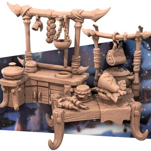 May include: A light brown miniature kitchen set featuring two wooden-style stalls with hanging food items, including a cluster of garlic, a bowl, and a meat joint. The set includes a countertop, a small pot, a lidded container, and skewers.