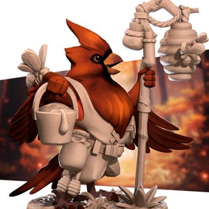 May include: A red cardinal figurine with a bucket of honey, wearing a white jumpsuit and holding a staff with a honeycomb and a pouch. The figurine is standing on a base with a leafy design.
