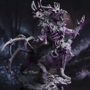 May include: A detailed, gray fantasy figurine of a creature with a deer-like head and antlers, a humanoid torso, and a spider-like lower body. The figure is posed on a rocky base, with a dark, blurred background.