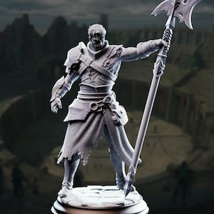 May include: A gray, stone-textured figurine of a warrior standing on a circular base. The figure wears detailed armor with a tattered cloth skirt and holds a tall, ornate polearm weapon with a sharp, multi-pointed blade in the right hand.