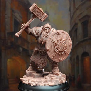 May include: A detailed miniature figurine of a dwarf warrior holding a warhammer and a shield with intricate carvings. The figurine is painted in a brown color and is standing on a rocky base.
