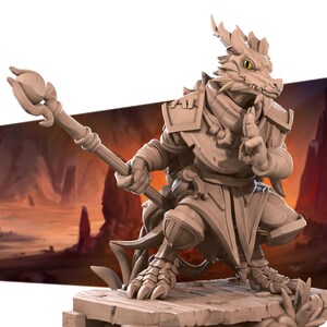May include: A small, detailed, beige dragon figurine with a staff in its hand. The dragon is wearing armor and a robe. The figurine is standing on a wooden base.