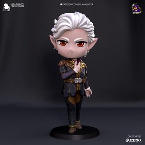 May include: A small, white-haired, vampire figurine with red eyes and a dark purple and gold outfit. The figurine is standing on a black base.