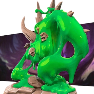 May include: A green, stylized monster figurine with a flowing, viscous appearance. The creature has brown horns and skull accents, and is posed on a rocky base. The overall design suggests a fantasy or gaming theme.
