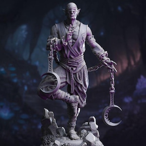 May include: A detailed sculpture of a figure with pointed ears, blindfolded, and in a meditative pose. The figure is adorned with chains and holds crescent-shaped objects. The statue is on a rocky base, with a dark, blurred background.