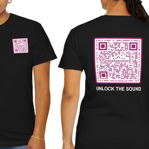 May include: Black t-shirt with a pink QR code on the back. The QR code has the text "beabadoobee" inside it. The text "UNLOCK THE SOUND" is below the QR code.