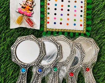 Combos consists of A german silver mirror A bindi packet And beautiful embroidery Potli used for Wedding gifts,  for all festive occasions.