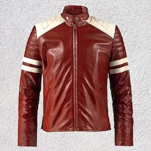 May include: A red leather jacket with white accents on the shoulders and sleeves. The jacket has a stand-up collar, a full-length zipper, and two white stripes on each sleeve. The jacket is a classic style.