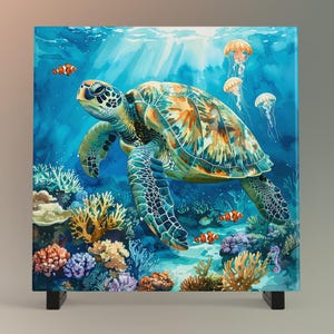 May include: Square canvas art featuring a watercolor painting of a sea turtle swimming in a vibrant coral reef. The artwork showcases a turtle with a patterned shell, surrounded by colorful coral, clownfish, and jellyfish, in shades of blue, green, and orange.