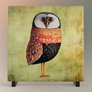 May include: A colorful owl with orange, black, and white patterned feathers stands on a green background. The owl has large, round eyes and a small beak.