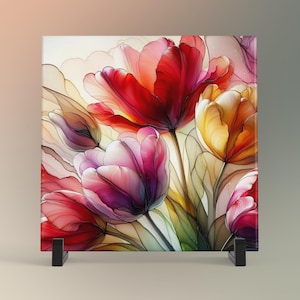 May include: A square glass tile with a colorful abstract painting of tulips. The tulips are in shades of red, pink, yellow, and white. The background is a light cream color.