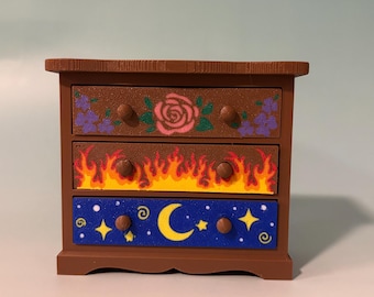 Fantasy inspired dresser bookshelf decor