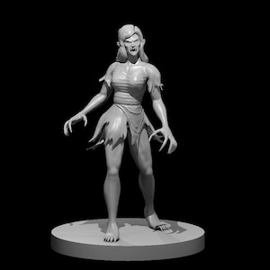 May include: A gray painted figurine of a female figure with long hair, wearing a torn garment and standing on a round base.