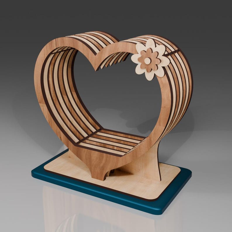 May include: A wooden heart-shaped shelf with a decorative flower design. The shelf is made of light brown wood with dark brown accents and sits on a teal base.