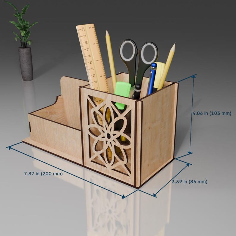 May include: Wooden desk organizer with a cutout design. It has a compartment for pens and pencils, a small drawer, and a larger compartment for other items. The organizer measures 7.87 inches wide, 3.39 inches deep, and 4.06 inches tall.