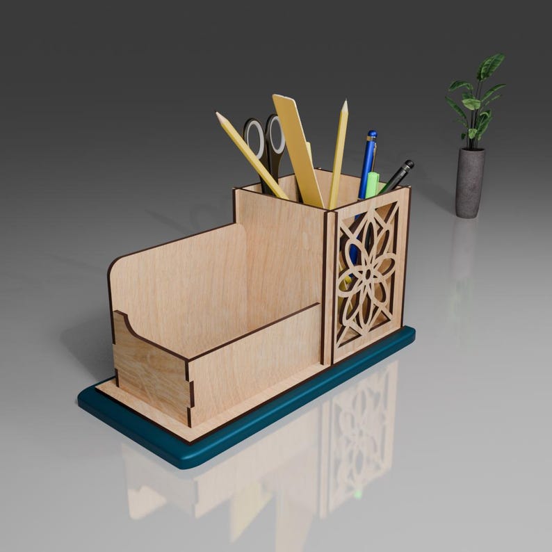 May include: A wooden desk organizer with a blue base. It has a compartment for pens and pencils, a slot for a ruler, and a small open compartment. The organizer is filled with various writing utensils.