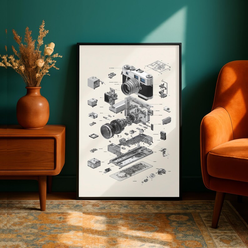 a large framed diagram of a camera, with various components and parts visible, displayed on a wall in a room with a wooden dresser and an orange armchair.