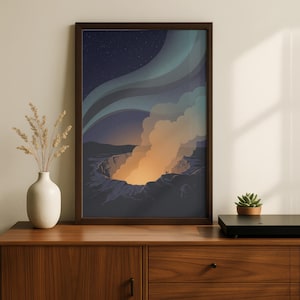 May include: Framed art print depicting a volcanic crater at night. The artwork features a dark blue sky with a green and blue aurora borealis. The crater glows with orange and yellow light, with two small figures on the rim.