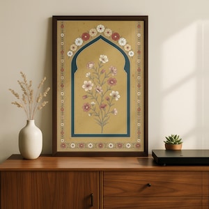 May include: Framed art print featuring a floral design. The artwork showcases a stylized floral arrangement within an arched frame, with a color palette of gold, blue, and various shades of pink and white. The print is encased in a dark brown wooden frame.