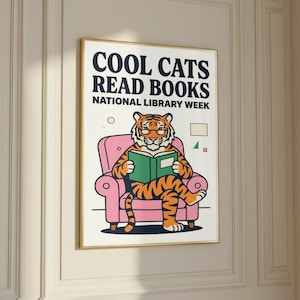 The image is a poster for National Library Week, featuring a cartoon tiger sitting in a pink chair and reading a book.