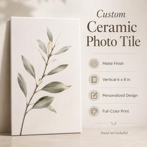 May include: A vertical ceramic photo tile with a matte finish, featuring a botanical illustration of a leafy branch. The tile is 15 x 20 cm and has a personalized design with a full-color print. The text on the tile reads "Custom Ceramic Photo Tile."