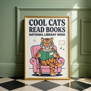 A poster for National Library Week featuring a cartoon tiger sitting in a pink chair and reading a book.