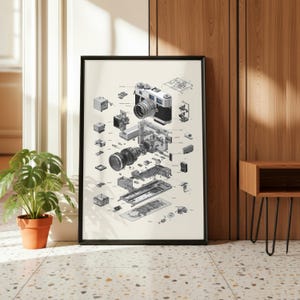 a large, framed poster of a disassembled camera, with various parts and components visible. The poster is displayed on a wall, and there is a potted plant and a wooden table nearby.