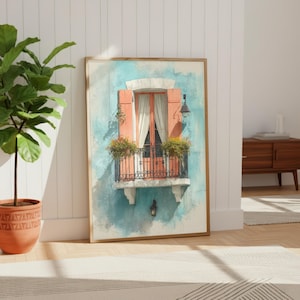 May include: Watercolor print of a balcony with peach shutters, a black wrought iron railing, and a teal wall. The balcony has flower boxes and a white curtain. The artwork is framed in a light brown wooden frame.