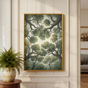 May include: A framed art print featuring a stylized forest scene. The artwork depicts a view looking up through the trees, with branches and leaves in shades of green and gray against a light background. The frame is gold.