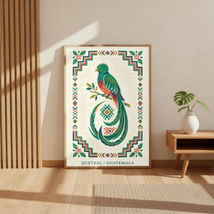 a large framed poster of a colorful bird, likely a parrot, with a geometric border and text that reads "Quetzal - Guatemala".