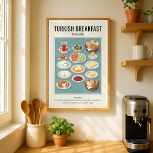 May include: A framed print titled "TURKISH BREAKFAST Kahvaltı" displays illustrations of Turkish breakfast foods, including tea, olives, cheese, tomatoes, cucumbers, honey, jam, butter, and eggs. The print is in a wooden frame, displayed on a kitchen counter with a coffee maker and wooden spoons.
