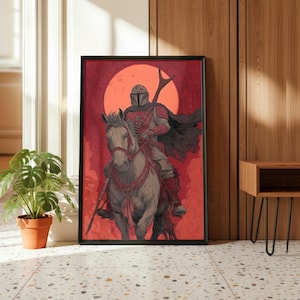 Op de afbeelding: Ingelijste kunstprint met een figuur in harnas te paard, tegen een rode achtergrond met een grote cirkelvormige vorm. Het kunstwerk heeft een gedetailleerde, illustratieve stijl met een donker kleurenpalet. De print wordt gepresenteerd in een zwart frame.