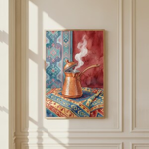 May include: Watercolor painting of a copper coffee pot with steam rising from the open lid. The pot sits on a colorful patterned textile, with a red and blue background. The artwork is framed in a wooden frame.