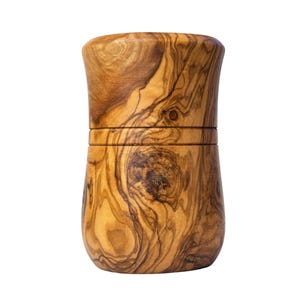 May include: A cylindrical wooden container crafted from olive wood, featuring a distinct natural grain pattern with swirling brown and tan tones. The object has a smooth, polished finish and a horizontal seam separating the lid from the base.
