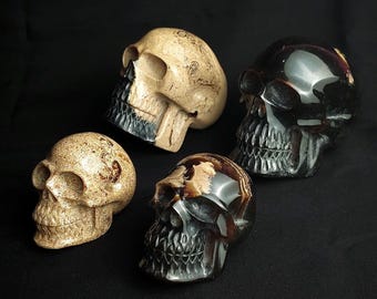 Sumatran Amber Skull Sculpture: Hand-carved Gemstone Decor with natural inclusions